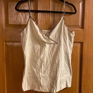 It’s plain tank w gold border on the top!